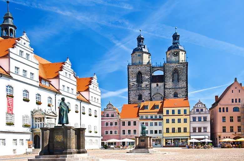 The monuments of Martin Luther and Philipp Melanchthon at Market Square, Wittenberg. Photo: LilGraphie/Shutterstock